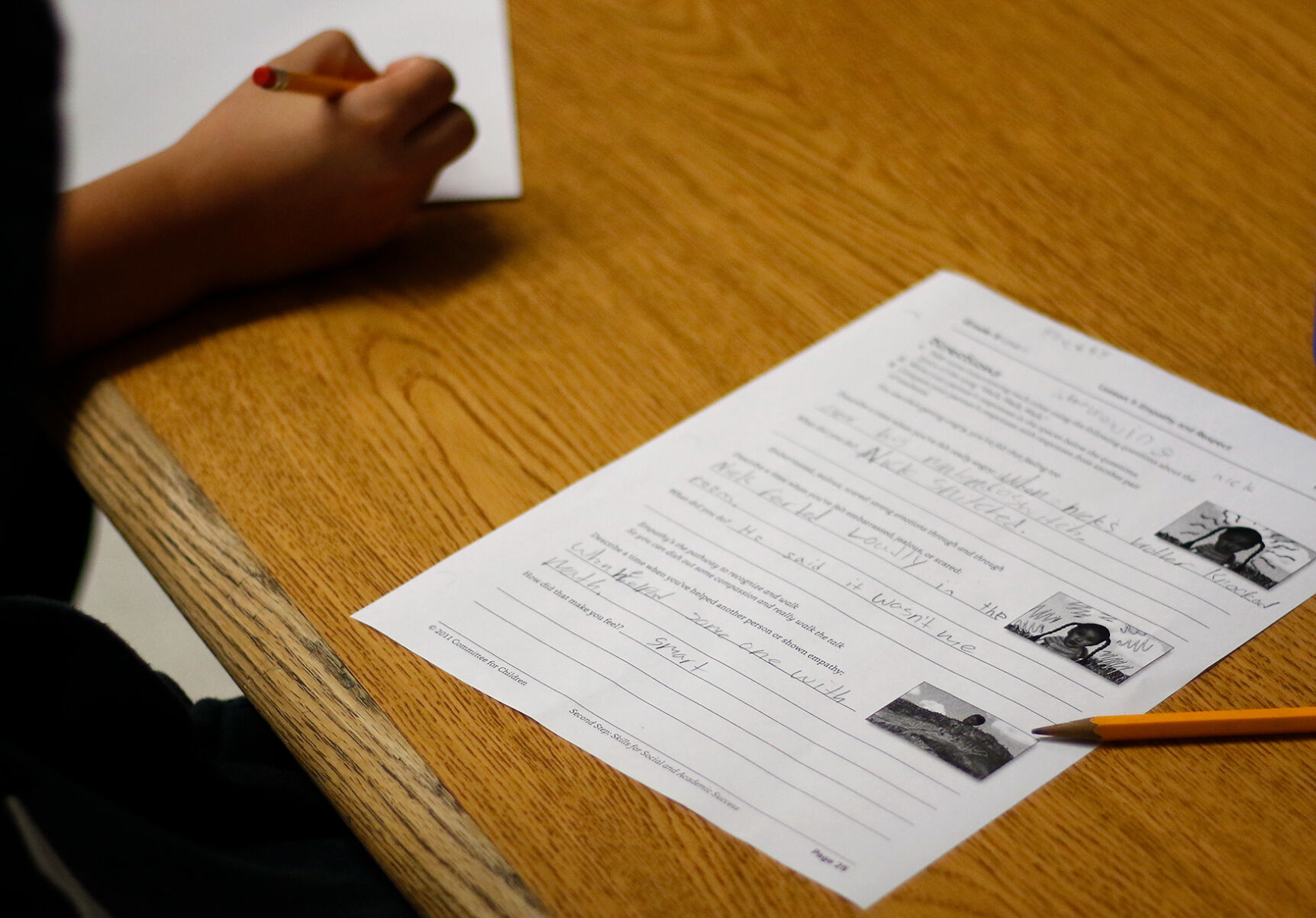 A worksheet shows students’ responses to questions about demonstrations of empathy and respect